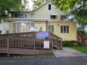 Parking and main entrance in the rear of the building.